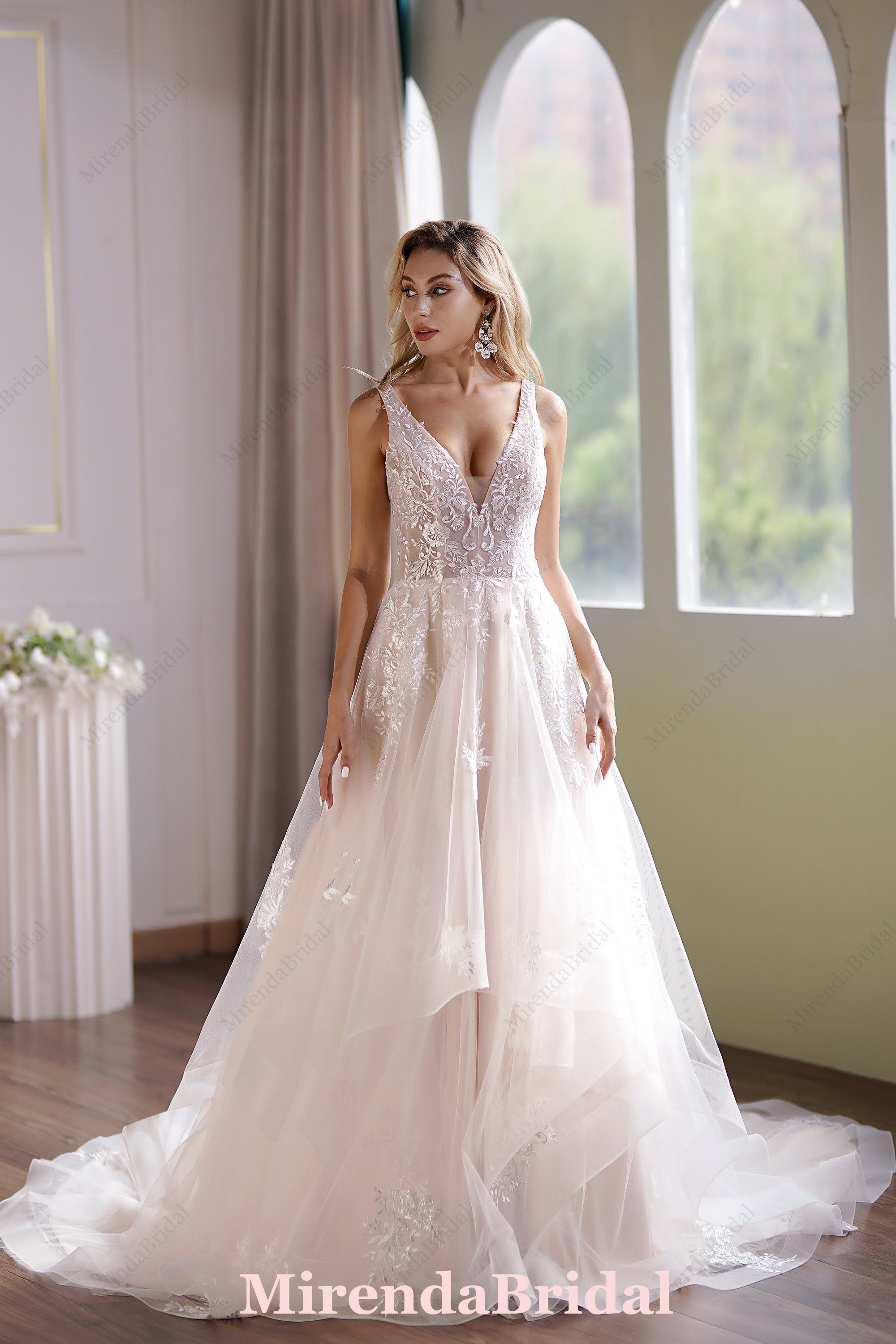 This Ball Gown Has A Sleeveless Bodice And A V-Neck Neckline