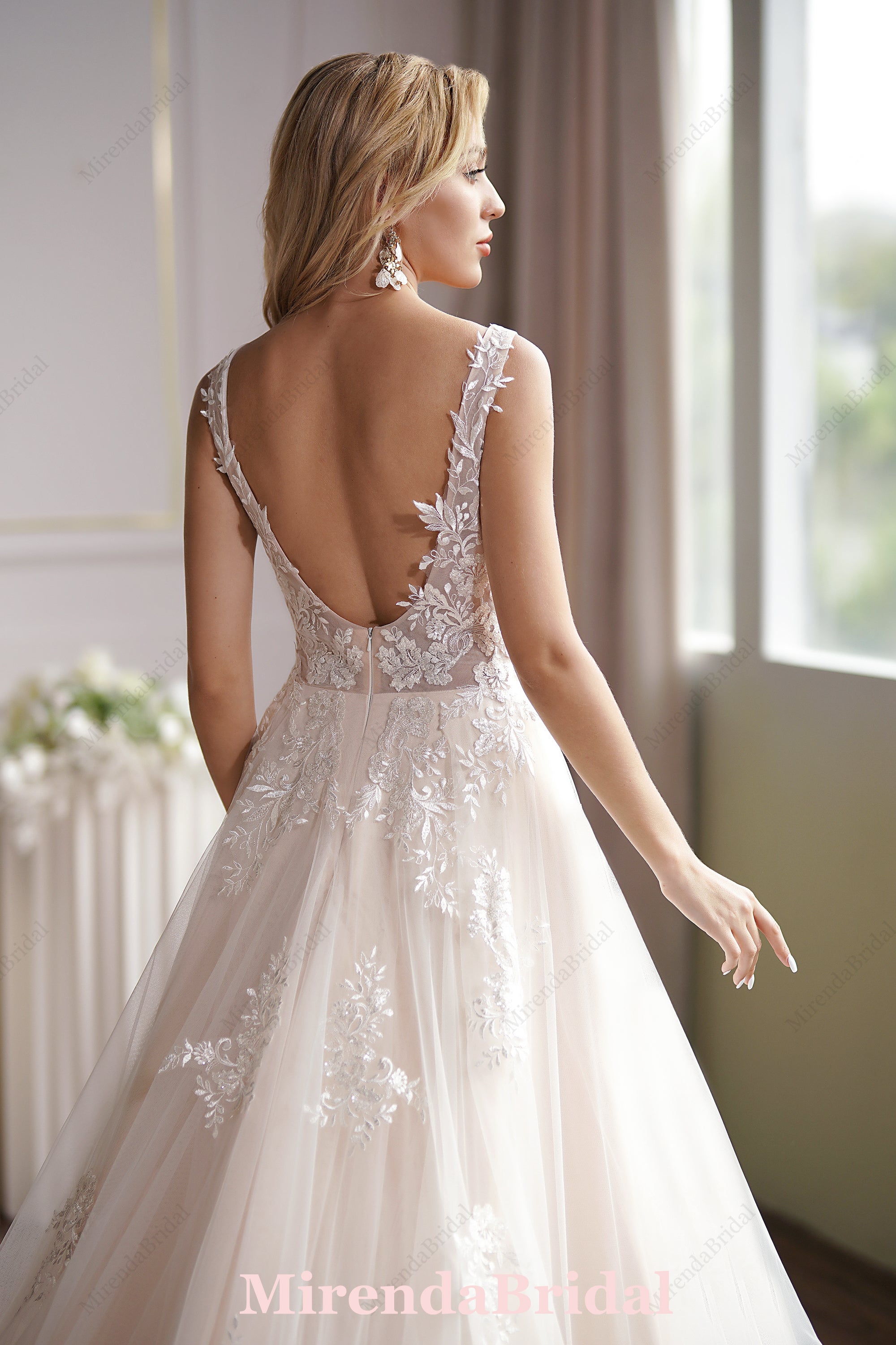 This Ball Gown Has A Sleeveless Bodice And A V-Neck Neckline