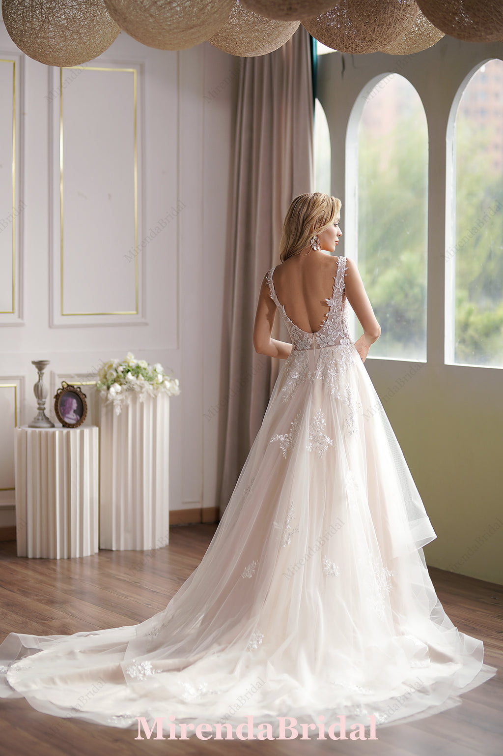 This Ball Gown Has A Sleeveless Bodice And A V-Neck Neckline