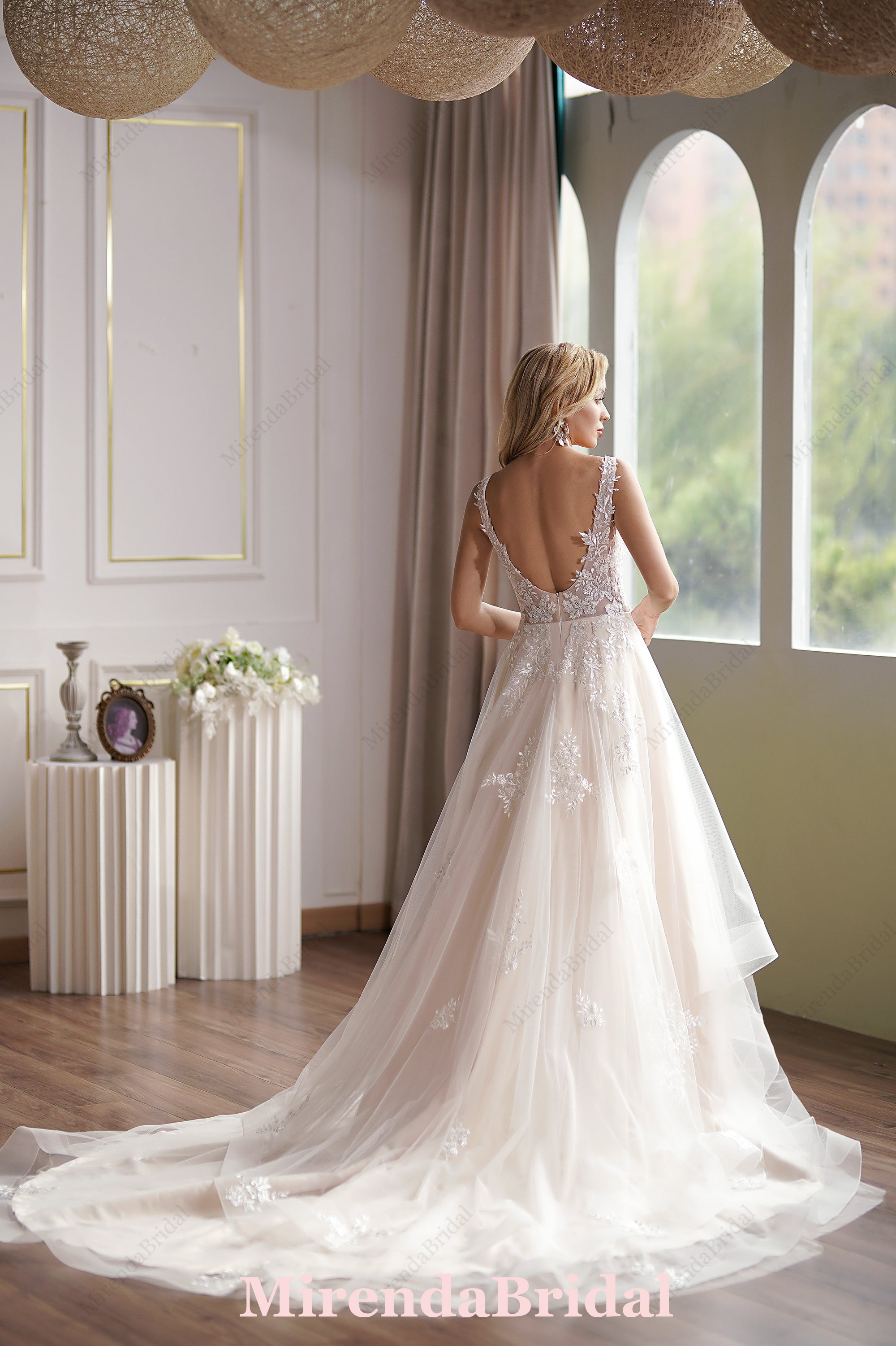 This Ball Gown Has A Sleeveless Bodice And A V-Neck Neckline